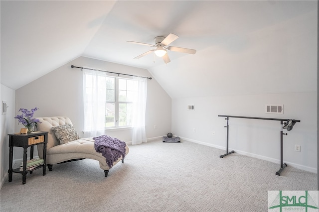 sitting room featuring vaulted ceiling, carpet flooring, and ceiling fan