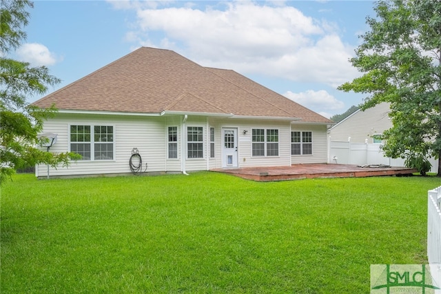 back of house featuring a patio area and a lawn