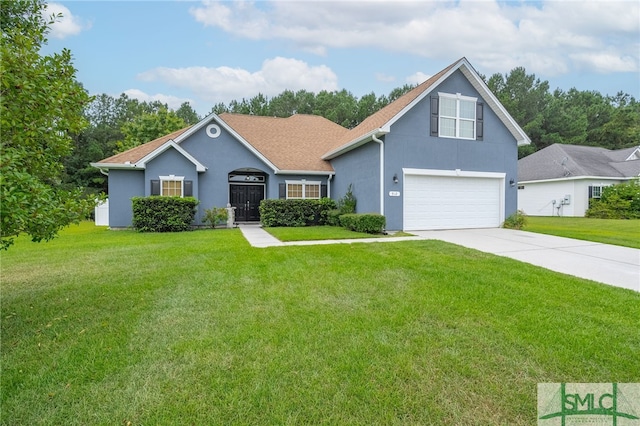 view of front of home featuring stucco siding, driveway, a front yard, and a garage