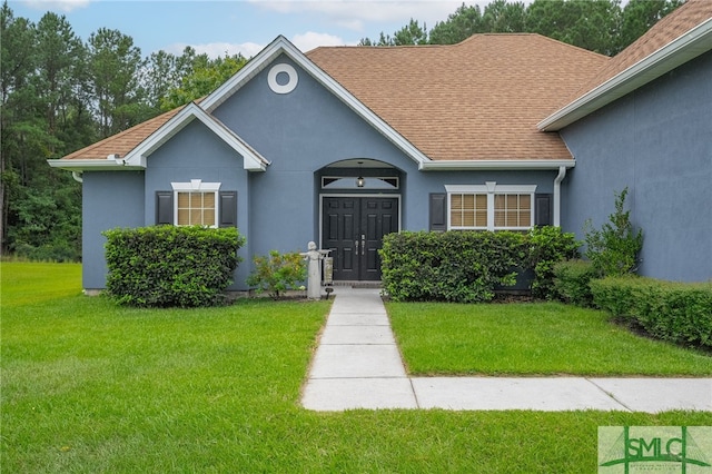 view of front of home with a front yard