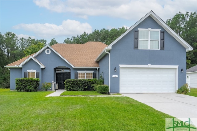view of front of house with driveway, a front yard, and stucco siding
