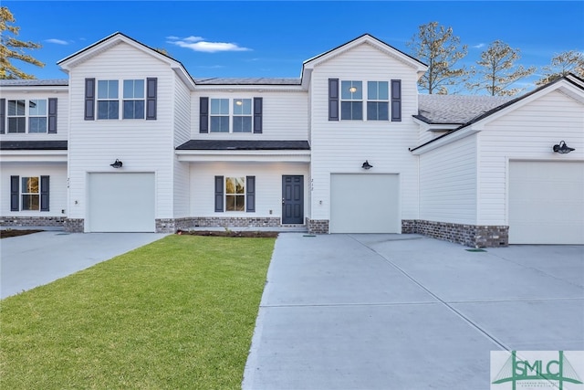 243 Haisley Run, Guyton, GA 31312 - view of front of property with concrete driveway, a front lawn, roof with shingles, and an attached garage