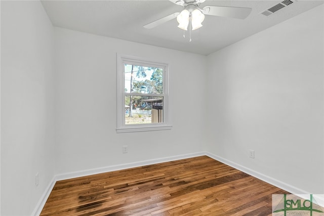 empty room featuring hardwood / wood-style flooring and ceiling fan