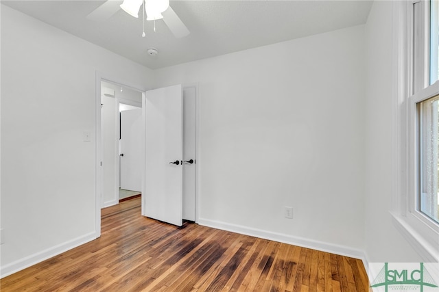 unfurnished room featuring wood-type flooring and ceiling fan