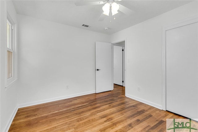 interior space with hardwood / wood-style floors and ceiling fan