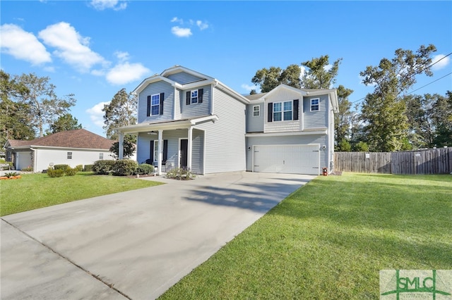 view of front of property with a front lawn, covered porch, and a garage