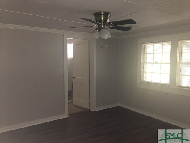 unfurnished room with ceiling fan, crown molding, and dark hardwood / wood-style floors