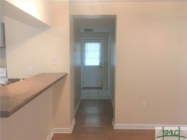 corridor featuring hardwood / wood-style flooring