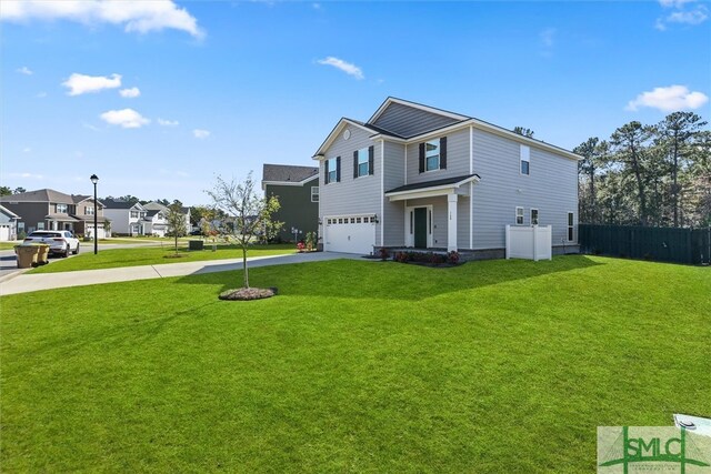 view of front of house featuring a front lawn and a garage