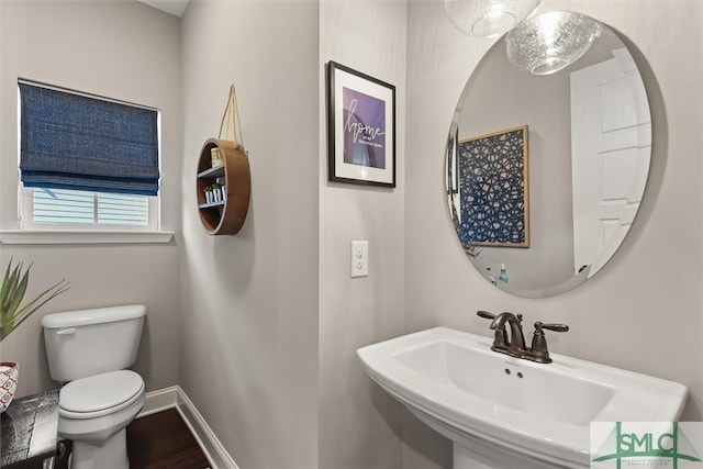 bathroom with toilet and sink