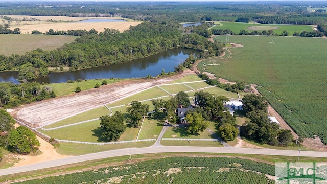 birds eye view of property featuring a water view and a rural view