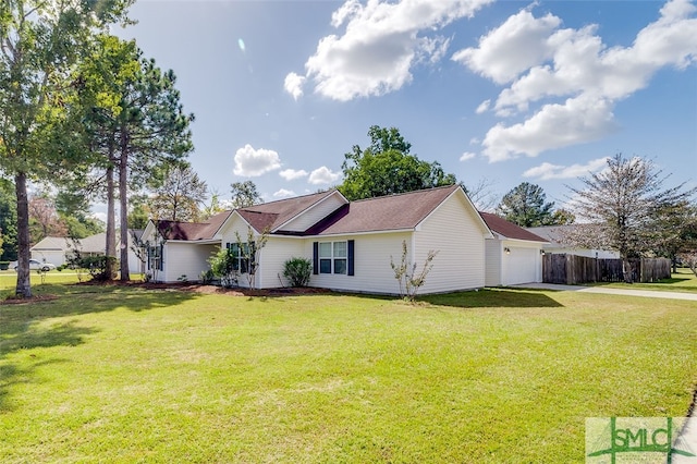 view of property exterior with a yard and a garage