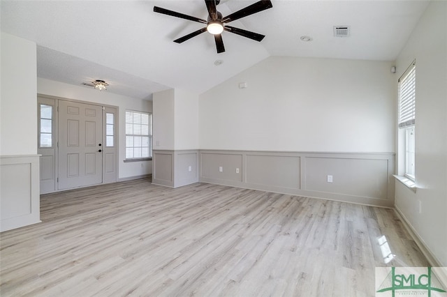 interior space featuring light hardwood / wood-style flooring, ceiling fan, and vaulted ceiling