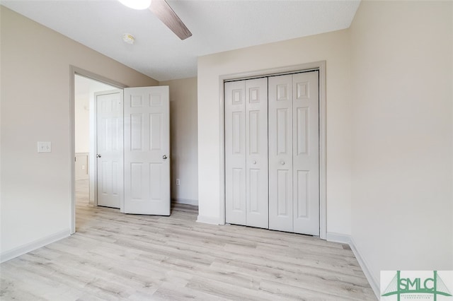 unfurnished bedroom featuring a closet, ceiling fan, a textured ceiling, and light hardwood / wood-style floors