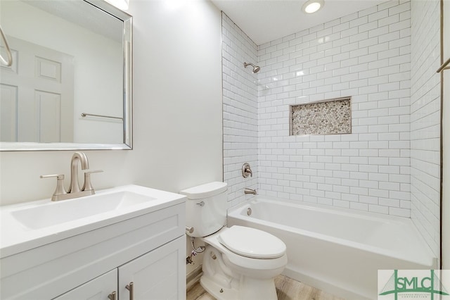 full bathroom with toilet, tiled shower / bath combo, vanity, and wood-type flooring