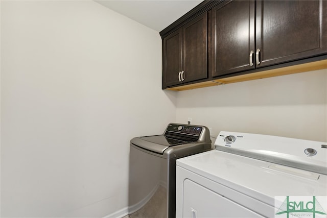 laundry area featuring cabinets and independent washer and dryer