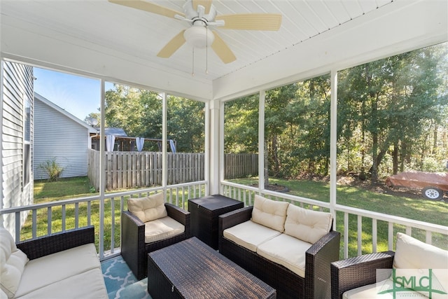 sunroom / solarium with ceiling fan and wooden ceiling