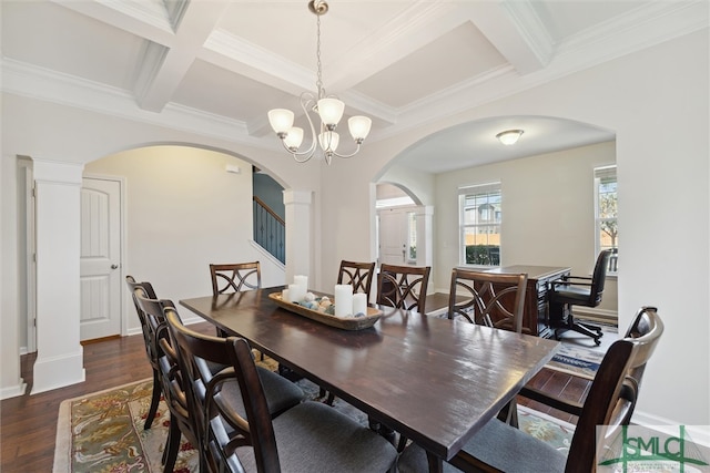 dining area featuring beam ceiling, ornamental molding, dark hardwood / wood-style floors, a notable chandelier, and coffered ceiling