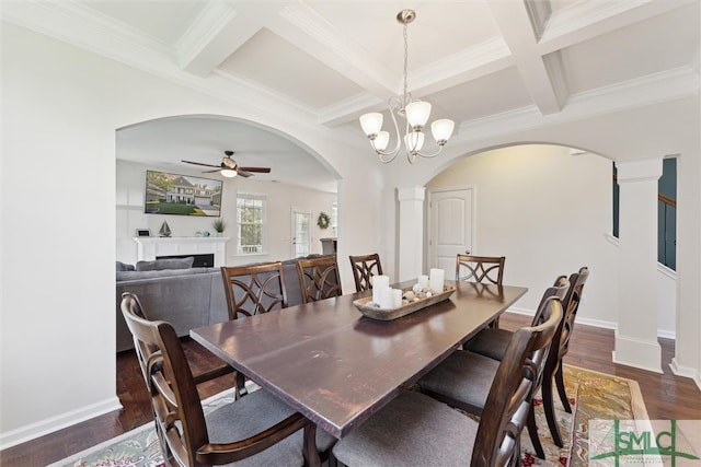 dining room with beam ceiling, coffered ceiling, dark hardwood / wood-style flooring, and ceiling fan with notable chandelier