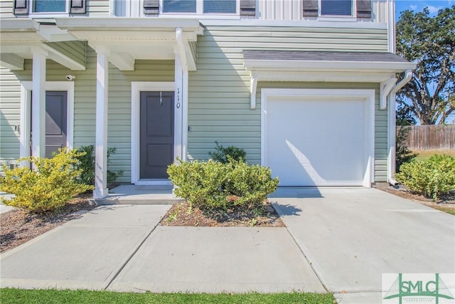 110 Benelli Dr, Pooler, GA 31322 - entrance to property featuring a garage, fence, and driveway