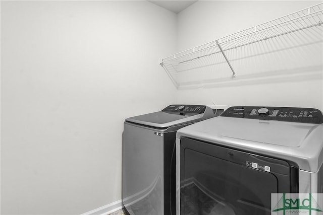 110 Benelli Dr, Pooler, GA 31322 - clothes washing area with baseboards, laundry area, and washing machine and dryer