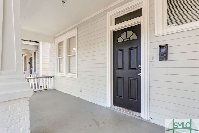 doorway to property with covered porch