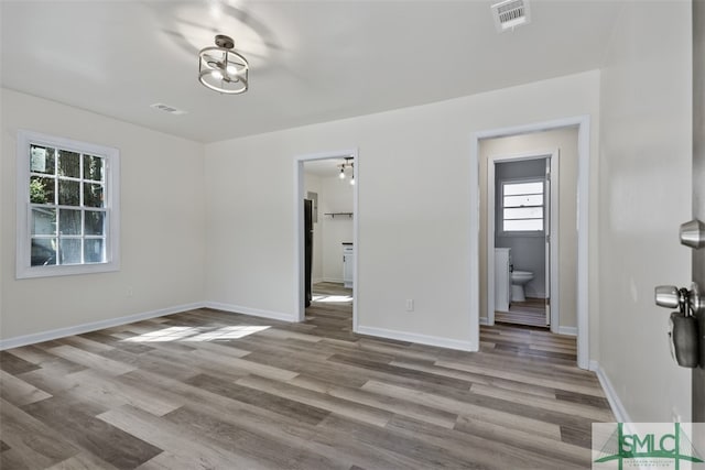 spare room with light hardwood / wood-style flooring