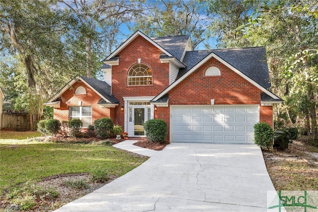 front of property featuring a front lawn and a garage