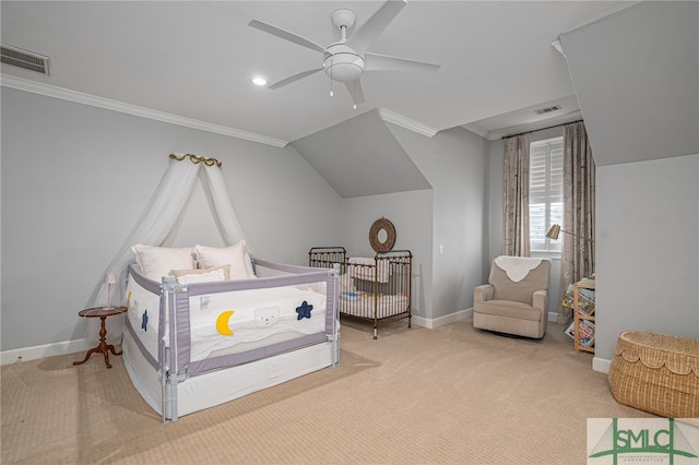 carpeted bedroom with ceiling fan, crown molding, and vaulted ceiling