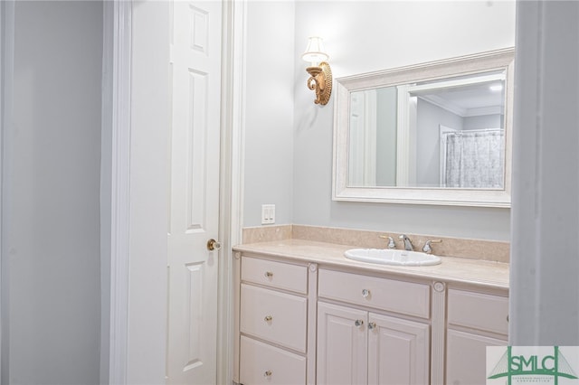 bathroom featuring vanity and crown molding