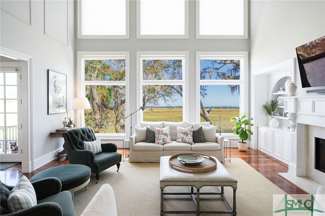 sunroom featuring a fireplace