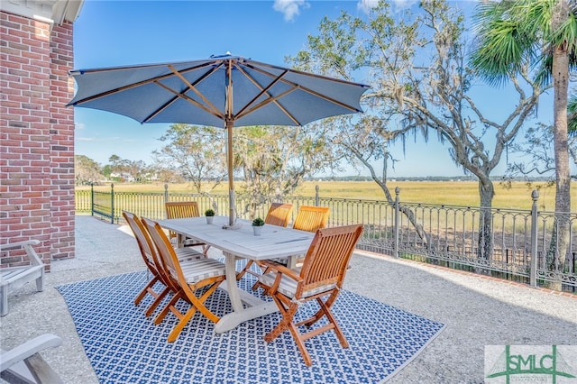 view of patio / terrace featuring a rural view