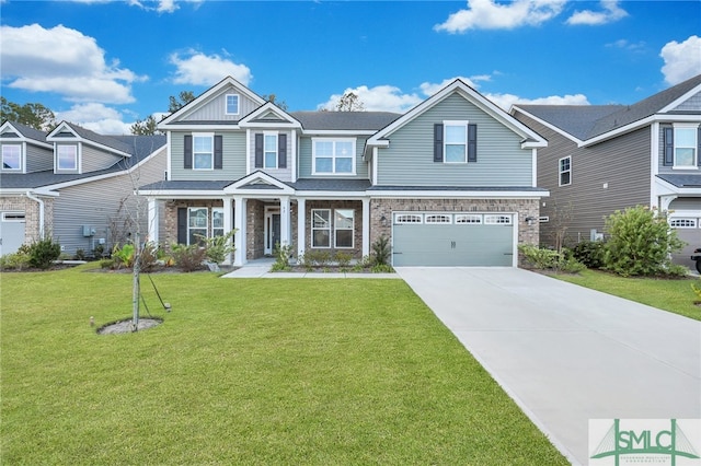 view of front of home with a front lawn and a garage