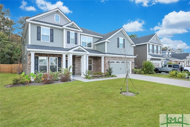 view of front of property featuring a front yard and a garage