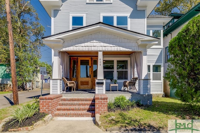 doorway to property featuring a porch