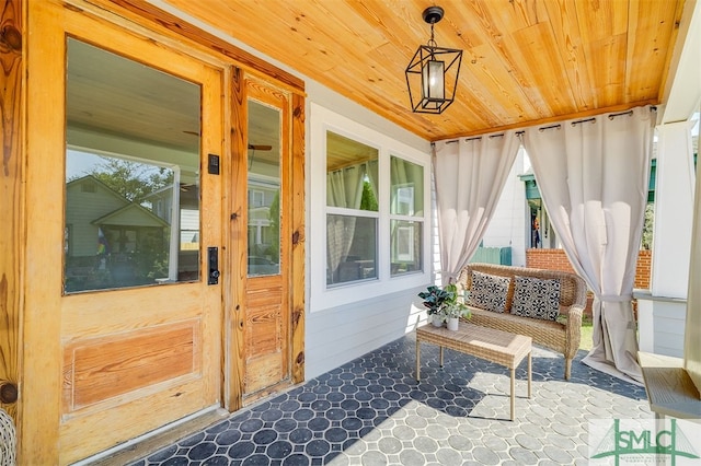 sunroom / solarium with wood ceiling