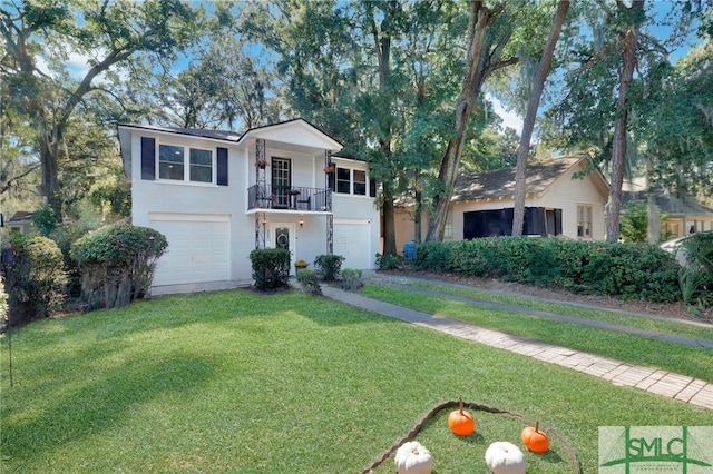 view of front facade with a front yard and a garage