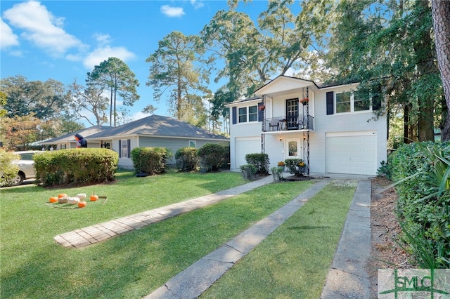 view of front of house featuring a balcony, a front yard, and a garage