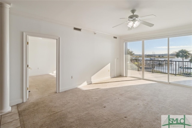 interior space featuring a water view, ceiling fan, ornamental molding, and light colored carpet