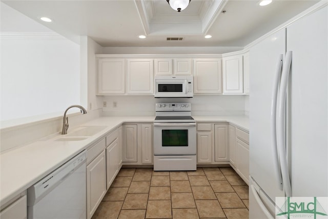 kitchen featuring white appliances, sink, white cabinetry, ornamental molding, and light tile patterned floors