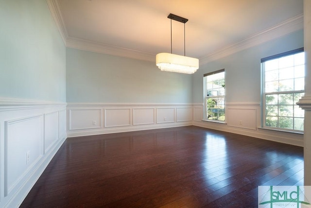 unfurnished room with dark wood finished floors and crown molding