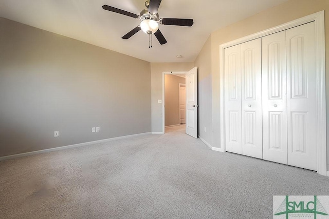 unfurnished bedroom featuring a ceiling fan, carpet, baseboards, and a closet