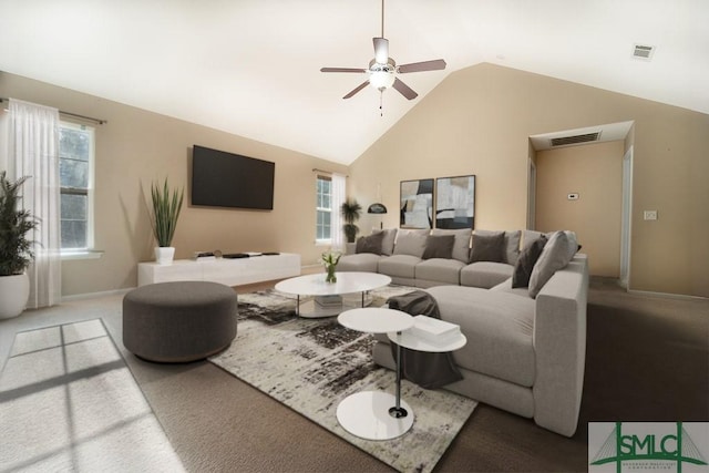 carpeted living room with baseboards, visible vents, vaulted ceiling, and a ceiling fan