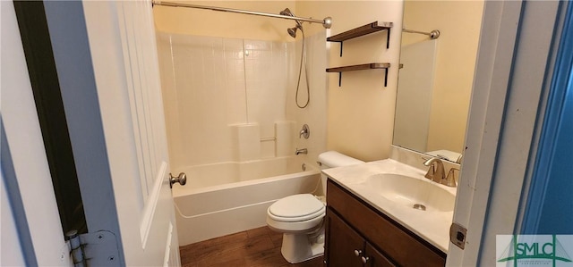 full bath featuring wood finished floors, tub / shower combination, vanity, and toilet