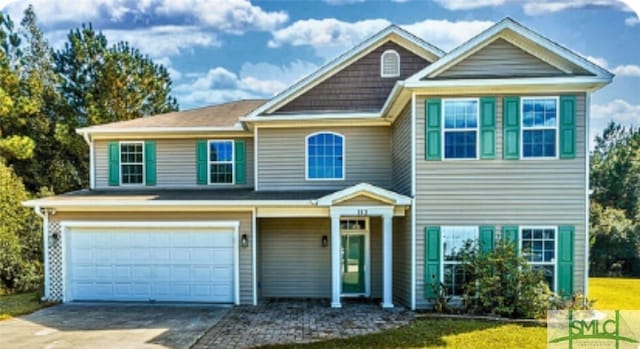 view of front of property with driveway and an attached garage