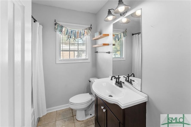 full bath with tile patterned flooring, toilet, vanity, and baseboards