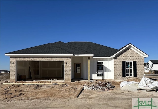 property in mid-construction featuring a garage