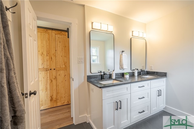 bathroom featuring vanity and hardwood / wood-style floors