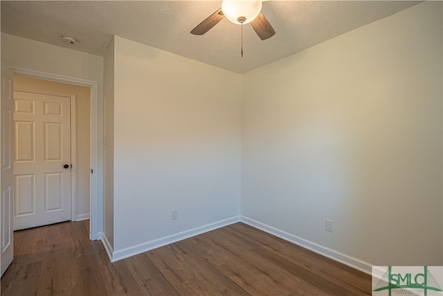 spare room featuring ceiling fan, wood-type flooring, and a textured ceiling