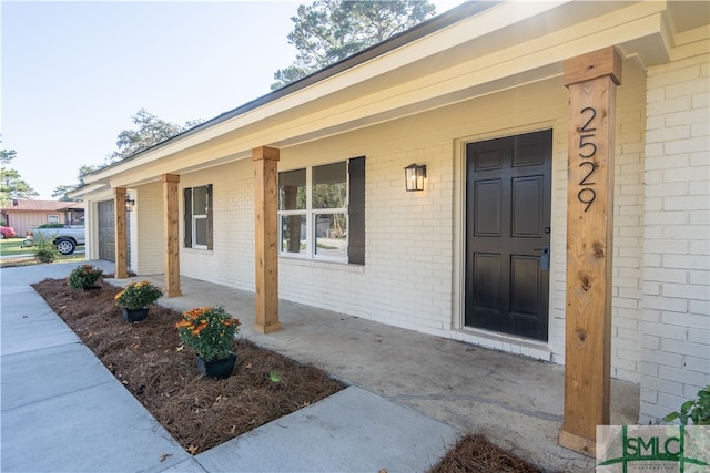 doorway to property with covered porch